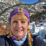 Woman smiling with purple bandana